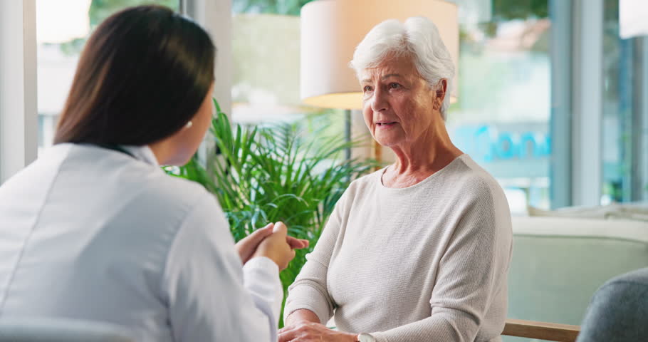 Healthcare, doctor and old woman in office, smile and support with recovery, healing or cure. Pensioner, medical advice or senior person with professional, treatment or conversation with consultation