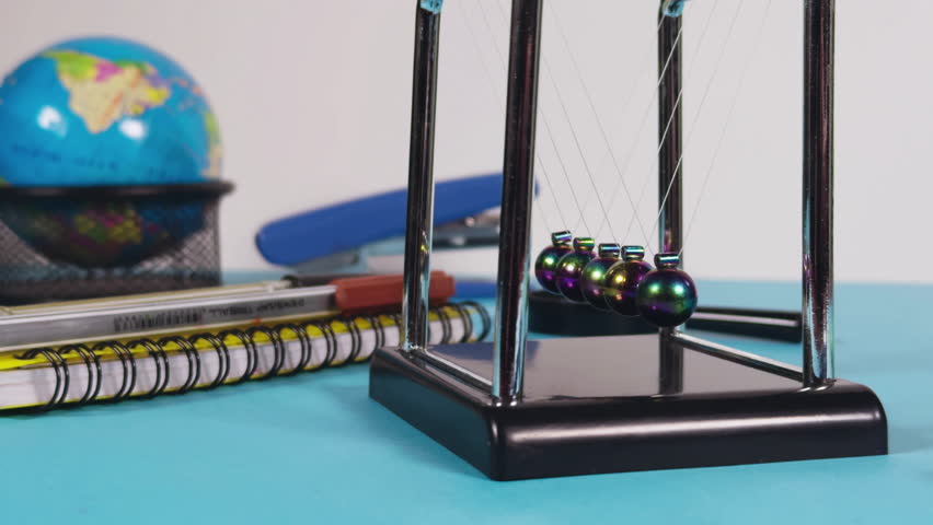 Educational Concept Newtons Cradle and School Office Equipment Tools Video