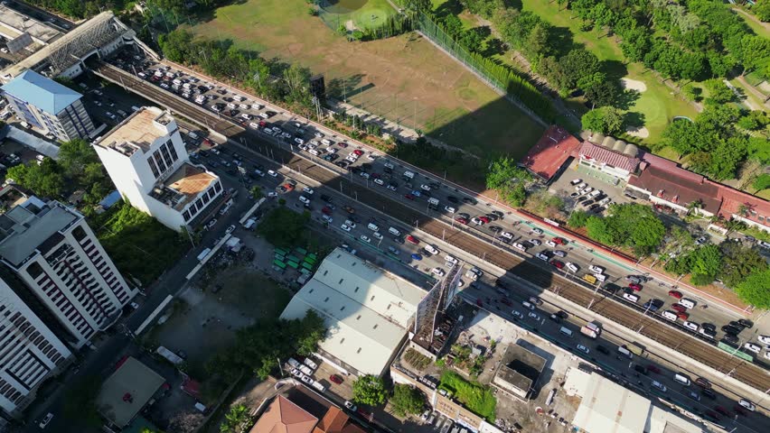 Slow Traffic Jam Over EDSA Highway Near Greenhills City In San Juan, Metro Manila, Philippines. Aerial Drone Shot