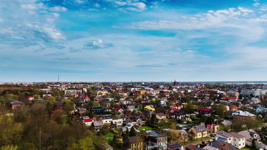 Smooth hyperlapse colorful Liepāja houses blooming in vibrant springtime scenery