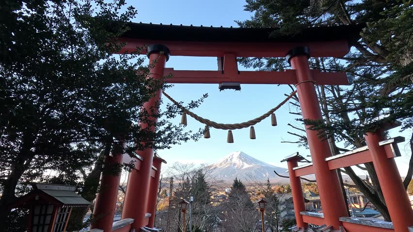 Mount Fuji in the morning framed by a beautiful Torii Gate a a shinto shrine, Arakura Shrine. Fujikawaguchiko Japan