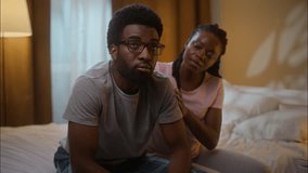 African American married family ethnic couple quarrel argument conflict guilty woman wife comforting calming ask for forgiveness annoyed man husband shaking head no never reject at home bedroom night - Powered by Shutterstock - Get 15% off with code: PIKWIZARD15