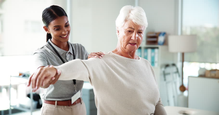 Physiotherapy, recovery or shoulder pain with consultant and patient in office for adjustment or treatment. Healthcare, joint injury and rehabilitation with people in clinic for medical assessment