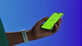 Asian middle aged male using smartphone with a blank green screen. Mobile app video mockup. Vertical phone orientation - Powered by Shutterstock - Get 15% off with code: PIKWIZARD15