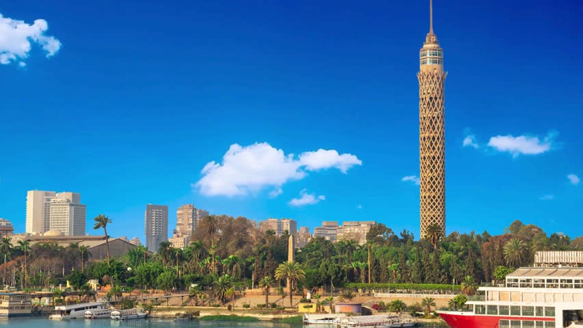 Tall TV tower in Cairo TV tower near Nile in Cairo at sunlight Nile and Cairo panorama in the evening. Egypt downtown, high-rise, green, summer, sun, clouds, tourism, tv, spire, broadcasting, landmark