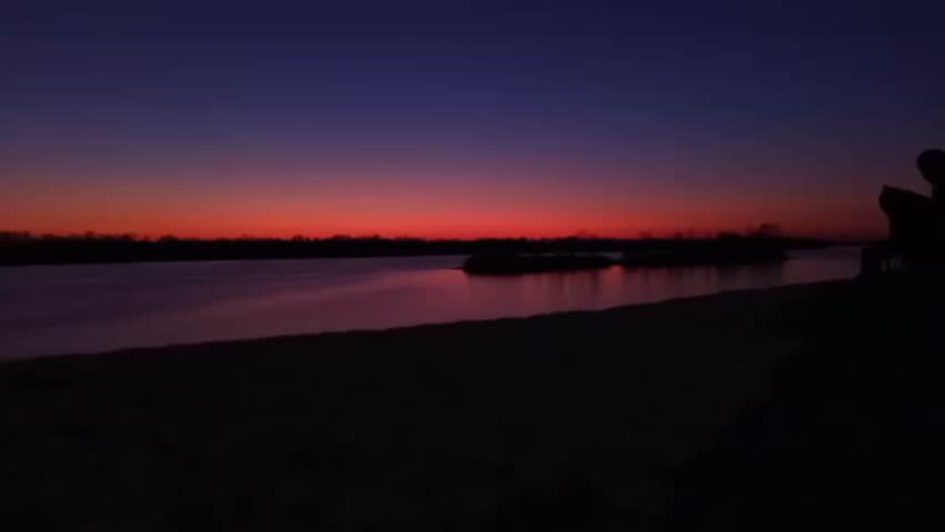 Beautiful red sunset over the lake shore