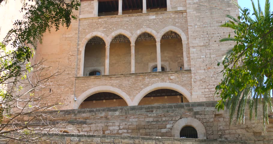 Exterior View Of Royal Palace of La Almudaina In Palma de Majorca, Spain. - tilt up shot