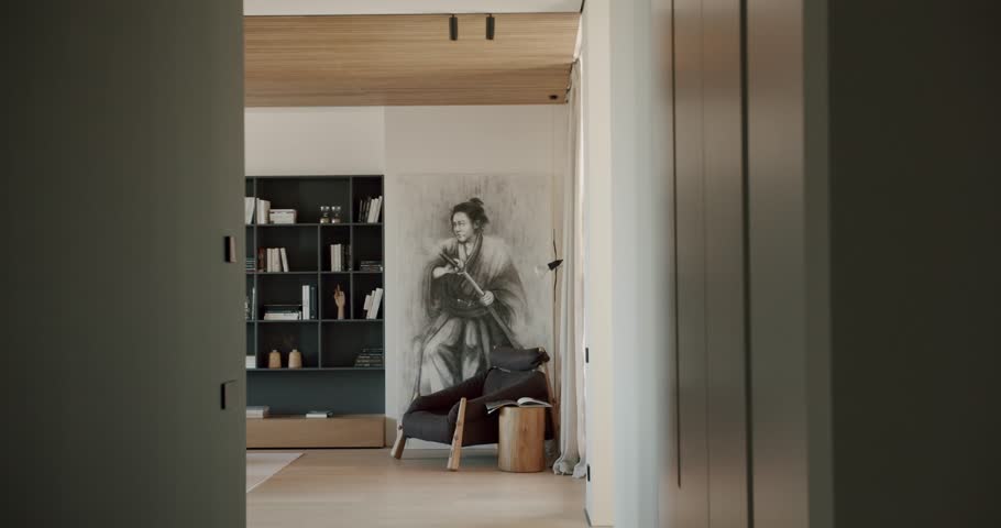 Modern, minimalist apartment with a unique samurai painting. The interior design features natural wood and neutral colors. The space is calm, sophisticated, and ideal for relaxation.