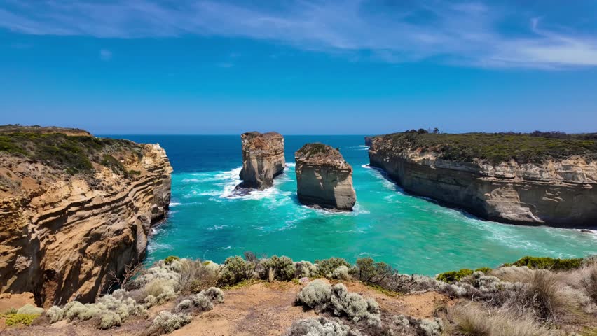 The Razor Back Lookout in the Great Ocean Road of Melbourne, Australia. Rock formations are smacked in the middle of the view of the ocean that stretches far into the horizon.