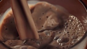 Hot chocolate is poured into a glass. Filmed on a high-speed camera at 1000 fps. High quality FullHD footage - Powered by Shutterstock - Get 15% off with code: PIKWIZARD15