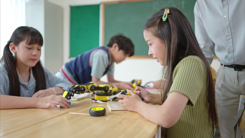 STEM Class, Teacher and students in basic engineering classroom