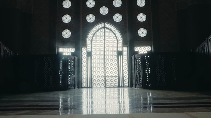 Grand Hassan II Mosque Interior: Sunlight Through Ornate Gate. Stunning Moroccan Architecture and Design. Casablanca Landmark, Islamic Art, and Cultural Heritage. Majestic Ambiance and Spiritual