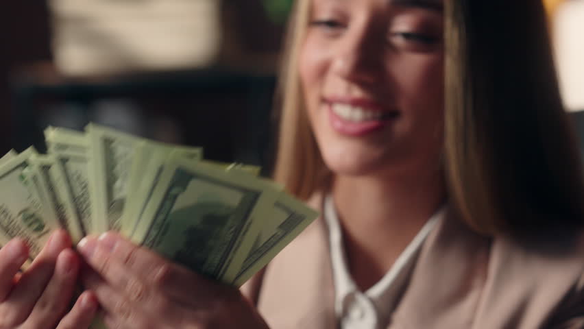 Close up successful smiling happy Caucasian business female hands counting money businesswoman girl entrepreneur employee count income salary prize woman working laptop online gambling victory indoor