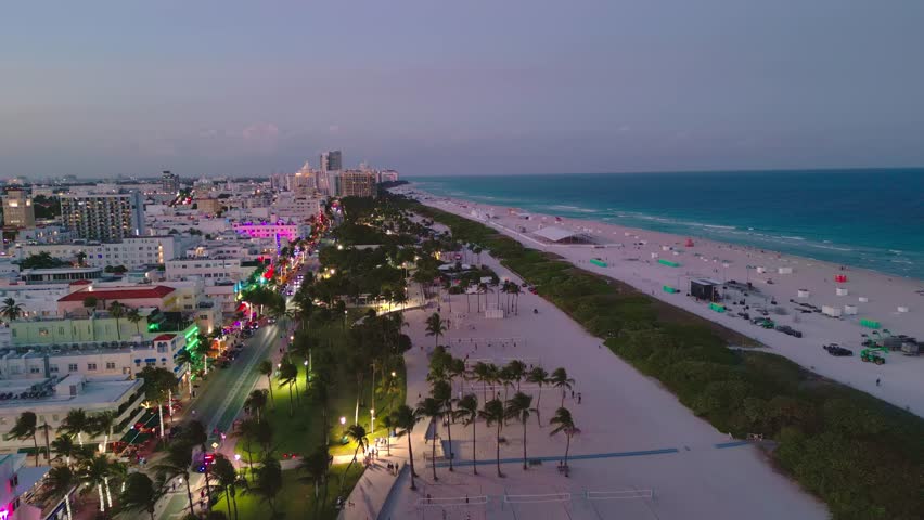 Miami Beach, Ocean Drive at night. Miami Ocean Drive seaside at dusk. Aerial view of night Miami Beach and cityscape of Ocean Drive. Ocean Drive of Miami Beach night shot from the air drone.