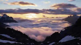 Sun Breaking Over Cloud Ocean and Rugged Mountain Peaks – Cinematic Dawn Timelapse - Powered by Shutterstock - Get 15% off with code: PIKWIZARD15