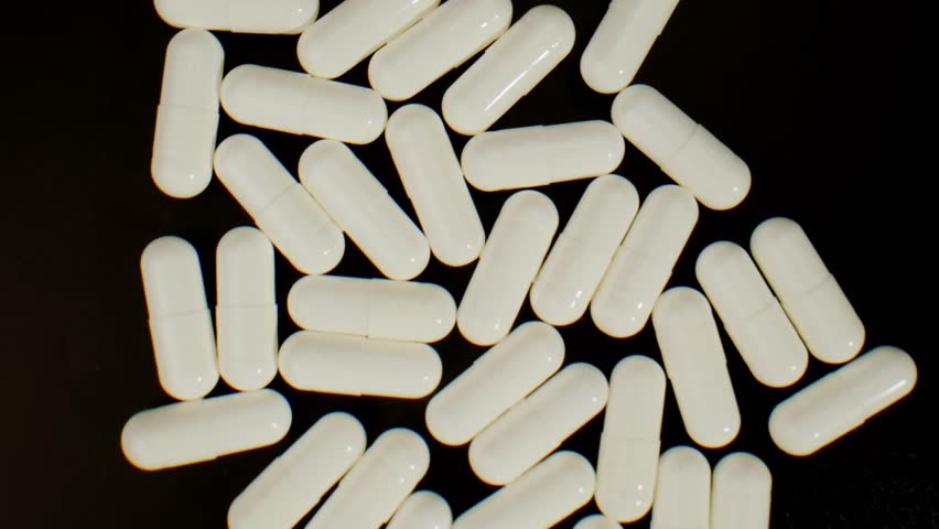Pills and vitamins macro, Close up view of womans hands holding plenty of different drugs. Painkillers and antibiotics. Healthcare and medicine concept