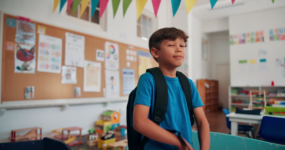 Happy, face and student with crossed arms in classroom for learning, education or childhood development. Backpack, portrait and boy kid with confidence for back to school at elementary academy.