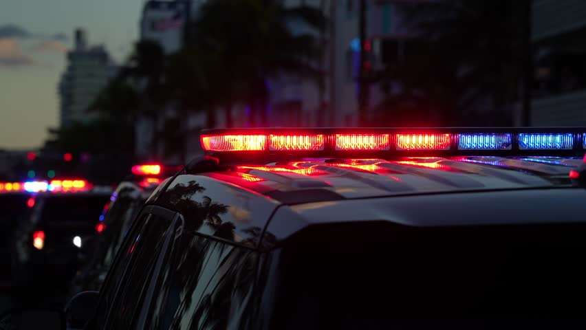 Police car lights flashing. Crime scene at night. Patrol vehicle outdoors. Emergency lights glowing. Flashing police siren. Police car. Law enforcement. City night patrol. Police arrest.