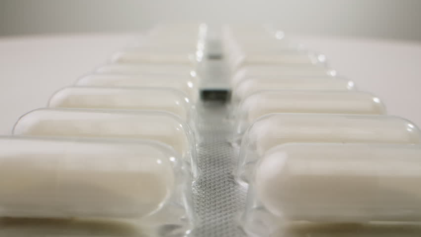Pills and vitamins macro, Close up view of womans hands holding plenty of different drugs. Painkillers and antibiotics. Healthcare and medicine concept