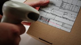 Scanner scan delivery box in storage, E-commerce shop, man packing goods and clothes second hand delivery market, courier Packaging and Shipping Workspace with Supplies and Technology, online sales. - Powered by Shutterstock - Get 15% off with code: PIKWIZARD15