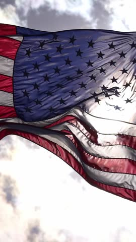 American flag waving on blue sky. United States flag. Flag in wind. Patriotic flags of America. USA national symbol. Freedom and democracy. Independence day. Stars and stripes. Waving USA flag.