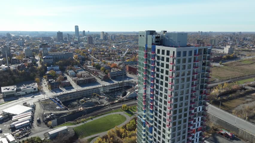 Lowering shot of high rise residential building under construction in west Ottawa, Canada