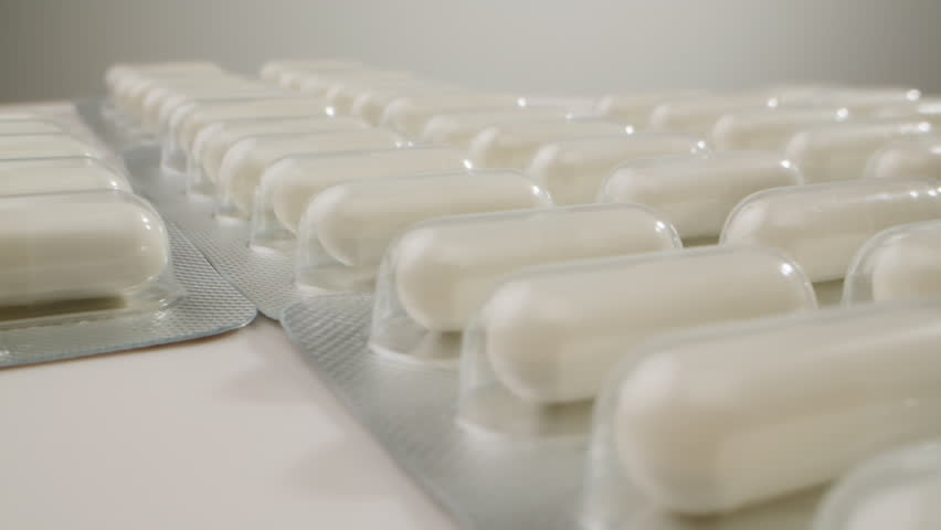 Pills and vitamins macro, Close up view of womans hands holding plenty of different drugs. Painkillers and antibiotics. Healthcare and medicine concept
