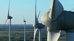 Wind farm at sunrise, wind generators aerial view, windmills generating electricity, drone shot, golden hour, green renewable energy, wind turbine - Powered by Shutterstock - Get 15% off with code: PIKWIZARD15