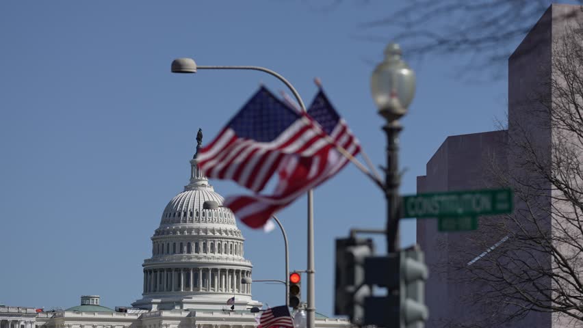 American construction flag waving. American construction at Capitol. Capitol in Washington DC. American construction site in Capitol. Construction and democracy in action. Vote and elect in America.