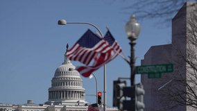 American construction flag waving. American construction at Capitol. Capitol in Washington DC. American construction site in Capitol. Construction and democracy in action. Vote and elect in America. - Powered by Shutterstock - Get 15% off with code: PIKWIZARD15