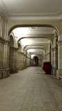 Empty stone corridor with arches and red poinsettia decorations - Powered by Shutterstock - Get 15% off with code: PIKWIZARD15