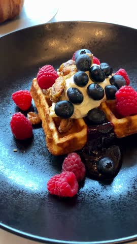  Delicious Waffle Topped with Fresh Berries and Cream in 4K Ultra HD – Sweet Breakfast or Dessert Dish with Whipped Cream, Blueberries, and Strawberries

