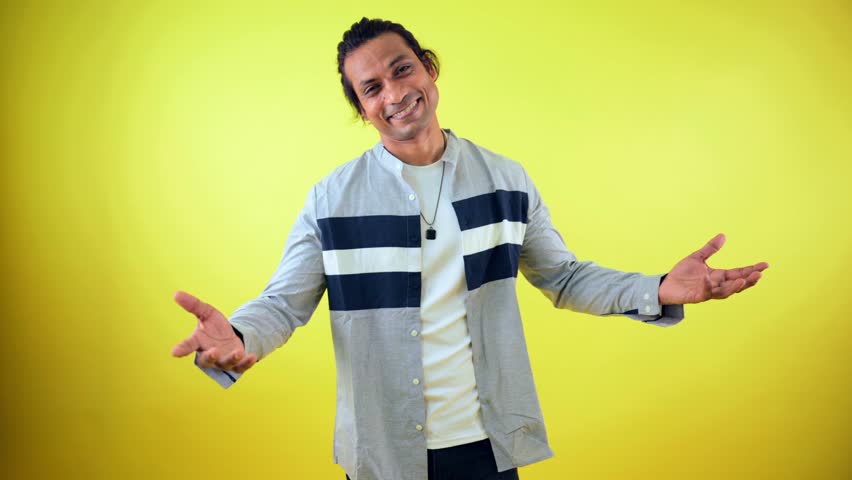 Model gestures playfully while posing during shoot, Smart Guy bold Postures for Stunning Fashion Photography, Person effortlessly pulls off trendy stance, Man with flawless pose, Portfolio Photoshoot
