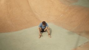 Contemporary male dancer performing dynamic, expressive choreography against urban skatepark backdrop, showcasing artistic movement and athletic skill through passionate dance sequence - Powered by Shutterstock - Get 15% off with code: PIKWIZARD15