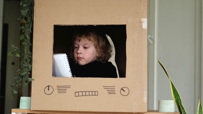 portrait boy presenter reading news from notebook on TV