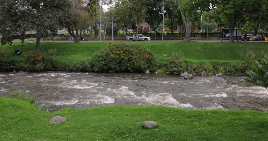 River flowing through a park, Rio Tomebamba, Cuenca, Ecuador.