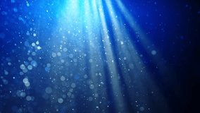 Deep underwater scene with floating particles in blue haze, creating a calm and mysterious atmosphere. Slow motion. A beam of light falling into the water highlights the floating particles. Slow - Powered by Shutterstock - Get 15% off with code: PIKWIZARD15