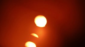 A warm-toned abstract blur image featuring a captivating lens flare effect, emanating a calming atmosphere. Slow motion. - Powered by Shutterstock - Get 15% off with code: PIKWIZARD15