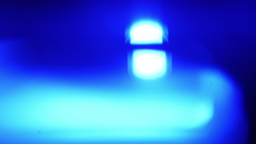 An artistic exploration of light, showcasing a stunning gradient of blue with brilliant white circles that play with perception and depth. Slow motion.