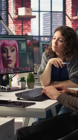 Vertical Video Creative agency team using AI to generate image models, operating editing software to enhance digital materials and create quality content. AI assistant with photo retouching. Camera A.