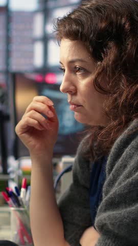 Vertical Video Day trader feeling worried and stressed looking at monetary losses, analyzing stock price trends on pc. Exasperated woman losing shares and dealing with market crash, trading decisions