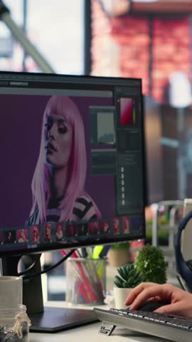 Vertical Video Digital media expert working on photo editing with professional software at creative agency, software tools. Using dual monitors to finish retouching with innovation in graphic design