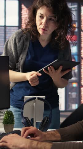 Vertical Video Professional editor uses AI powered software and PC reels in a creative office, marketing strategy used in targeting viral trends and boosting online followers and exposure. Camera A.