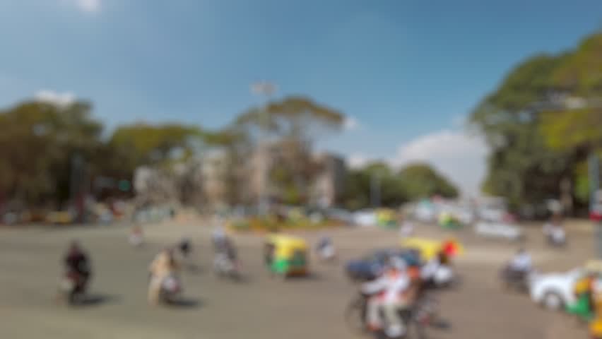 Bokeh view of road traffic on the streets of Bangalore, India. Blurred background footage.