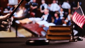 A courtroom scene with a gavel, American flag, and legal books - Powered by Shutterstock - Get 15% off with code: PIKWIZARD15