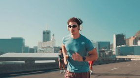 Headphones, athlete and check time with running in city for workout pace, performance monitor and track progress. Man, smart watch and sunglasses for marathon speed, fitness podcast or exercise music - Powered by Shutterstock - Get 15% off with code: PIKWIZARD15