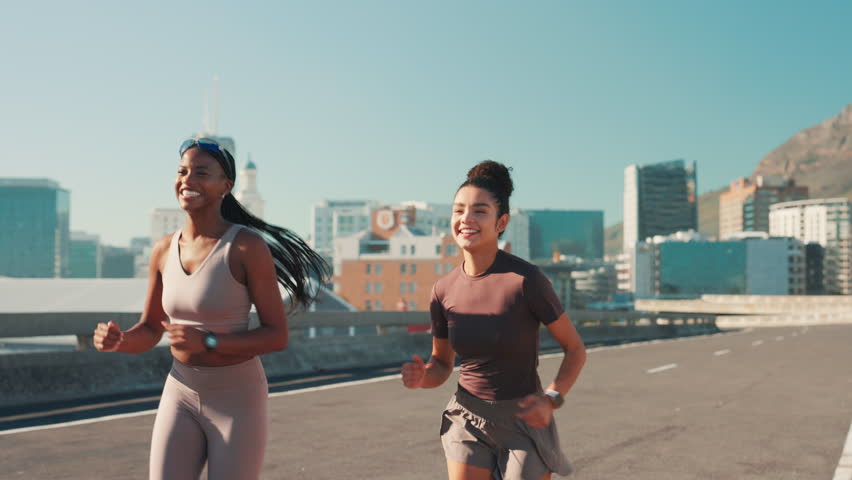 Outdoor, friends and running with fist bump for fitness, motivation and partnership for training in city. Road, people and women with hand gesture for exercise growth, workout challenge and happiness