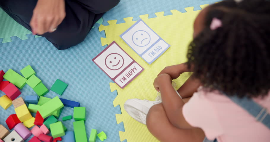 Hands, speech or therapist with child, cards or adhd with education, questions or help. Sad, happy and above of girl kid in therapy with counseling evaluation, wellness assessment and mood choice