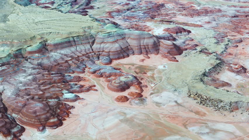 Cinematic aerial shot of abstract patterns of desert landscape in Hanksville, Utah, USA