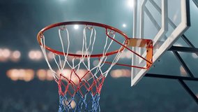 ball goes in basket in arena. a basketball player performing the slam dunk. Basketball going through basketball hoop with net in arena. Sport Concept. - Powered by Shutterstock - Get 15% off with code: PIKWIZARD15